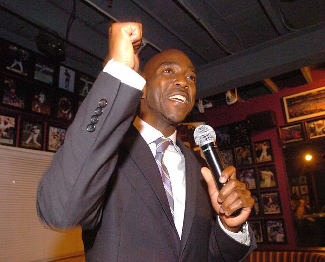 Jass Stewart pumps his fist while speaking to supporters at his post-election party at Progressions After Dark.