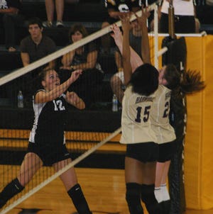 St. Amant’s Kayla Young sends a shot over against Hahnville in the Lady Gators’ 25-6, 25-19, 25-17 sweep to wrap up the District 3-I crown Thursday night.