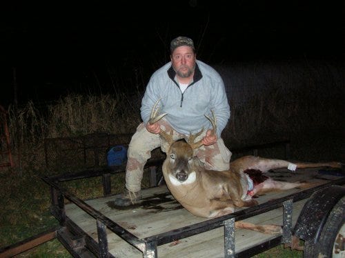 Donnie Costello, of Rockford, shout this 220-pound, 11-point buck with a bow and arrow Wednesday, Nov. 11, 2009, in Jo Daviess County outside of Stockton.