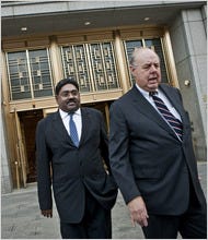 Raj Rajaratnam, left, founder of the Galleon hedge fund, leaving his bail hearing in New York with his lawyer, John Dowd.