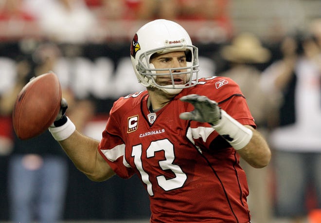 Arizona Cardinals' Kurt Warner (13) looks to throw against the Carolina Panthers in the first half of an NFL football game Sunday, Nov. 1, 2009, in Glendale, Ariz.