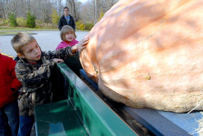 Lebanon Elementary School second grader Jeffry Stober checks out the 1,183-pound pumpkin.