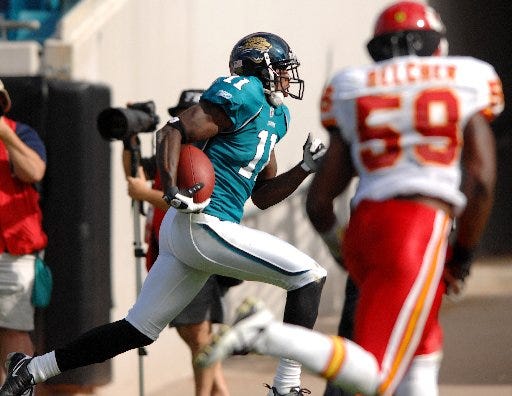RICK WILSON/The Times-UnionJacksonville Jaguars receiver Mike Sims-Walker sprints to the endzone for a 61 yard touchdown against the Chiefs.