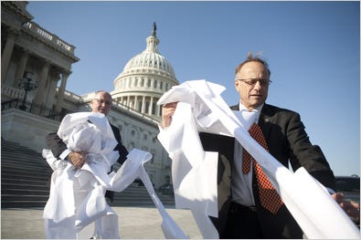 Two Republicans, Steve King of Iowa, right, and Peter Hoekstra of Michigan, crumpled a copy of the bill Saturday.