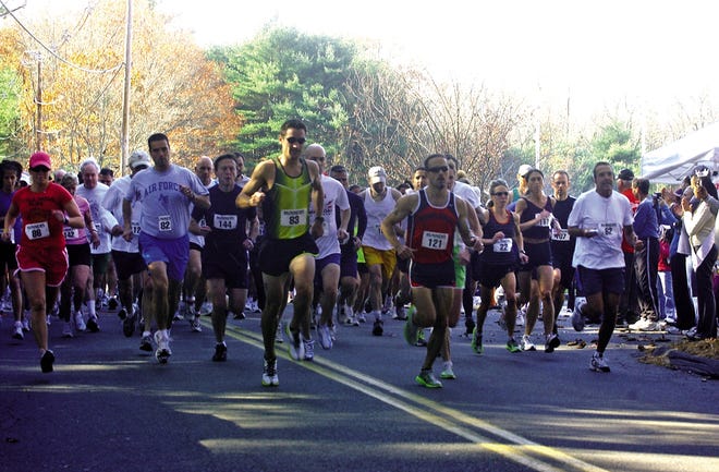 Runners leave the starting line Sunday morning at the Victoria L. Mosier Memorial Road Race in Raynham.