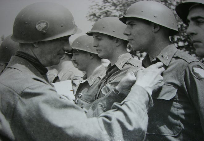 Gen. Terry Allen pins a Bronze Star on 1st Lt. Arthur Mason of Framingham during World War II.
