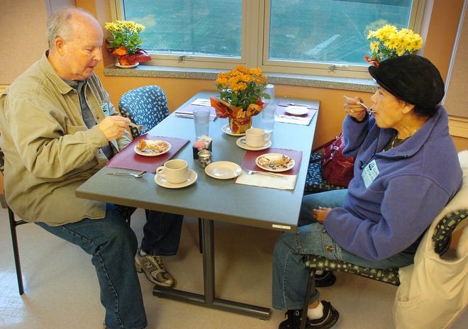 Bill and Diana Healey of Quincy enjoy dessert at Presidents Cafe at Quincy High School.