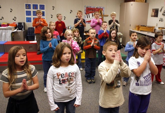 Bella Cooper, left, Shelby Hodel, Brendon Bishop and Sydney Ater rehearse for an upcoming performance during their second grade music class at Sherman Elementary School Thursday, Nov. 5, 2009. Only one art class was eliminated during Williamsville school district's budget cuts -- a kindergarten art class.