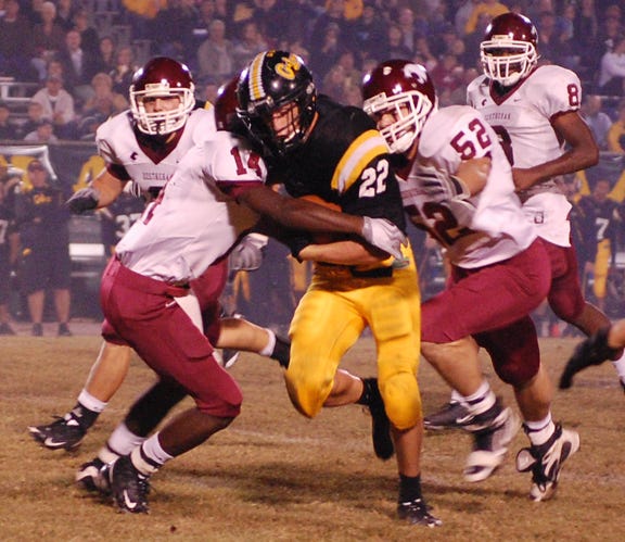 St. Amant’s Daniel St. Pierre carries against Destrehan in the Wildcats’ 34-33 District 6-5A victory Friday night at the Pit. St. Pierre rushed for 108 yards on nine carries for the Gators scoring once.