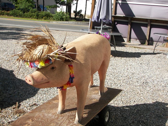 Perfect, a life-size pig statue, was returned to True Blue BBQ in Kingston on Sunday, two months after being stolen.