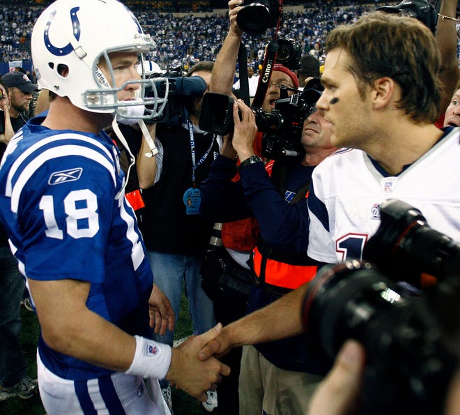 Indianapolis Colts quarterback Peyton Manning, left, and New England Patriots quarterback Tom Brady (12) meet at midfield after the Patriots beat the Colts, 24-20, in the NFL football game Sunday, Nov. 4, 2007 in Indianapolis. (AP Photo/The Indianapolis Star, Sam Riche)