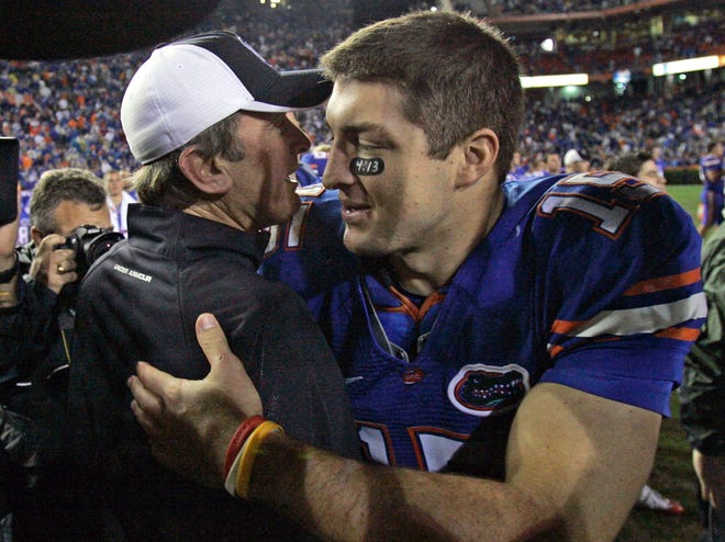 Florida quarterback Tim Tebow, right, greets South Carolina coach Steve Spurrier after the Gators’ 56-6 win last season in Gainesville, Fla.