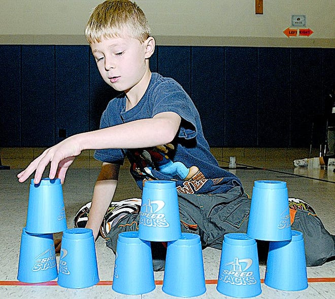 Owen Emig a second grader at Orchard Hill School in North Canton participated in sport stacking during gym class Thursday, Nov. 12, 2009.