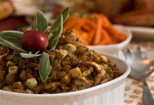 By doctoring a bag of stuffing mix this Thanksgiving, put this sausage stuffing with apples and sage on your holiday table this year. (AP Photo/Larry Crowe)