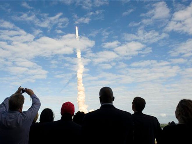 In this photo provided by NASA, guests at NASA's Kennedy Space Center view the launch of space shuttle Atlantis in Cape Canaveral, Fla., on Monday, Nov. 16, 2009. Space shuttle Atlantis and its six-member crew began the 11-day STS-129 mission to the International Space Station. The shuttle will transport spare hardware to the outpost and return a station crew member who spent more than two months in space.