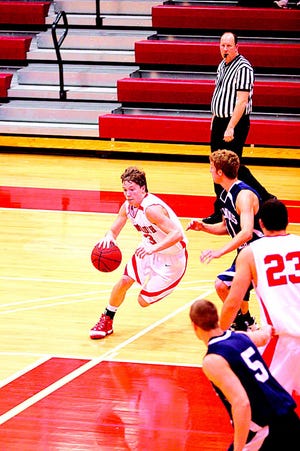 Eric Grant drives the lane during the 2008-09 basketball season at Monmouth College