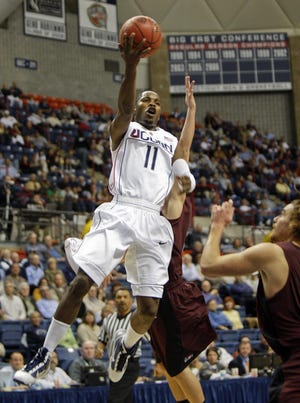 Connecticut's Jerome Dyson, above, attempts a lay-up against Colgate during the first half of the NIT Season Tip-Off game in Storrs, Conn., on Monday, Nov. 16, 2009.
