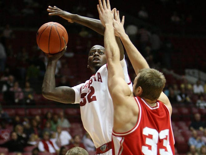 Jamychal Green (32) shoots of the head of Cornell defender Alex Tyler (33) on Saturday. The Tide hosts Jackson State tonight at 7:30.
