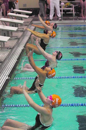 Scots and Prairie Fire swimmers start a back stroke at their dual meet earlier this month