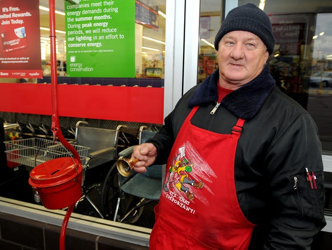 Clifford Clark of Freeport rings a bell for Salvation Army donations at KMart in Freeport Tuesday.