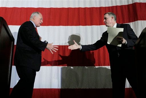 Illinois Gov. Pat Quinn, left, shakes hands with state Comptroller Dan Hynes after their Democratic gubernatorial debate Wednesday, Nov. 18, 2009, in Chicago. (AP Photo/M. Spencer Green)