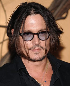In this Nov. 17, 2009 file photo, actor Johnny Depp attends The Museum of Modern Art's film benefit tribute to Tim Burton in New York. Depp was named People magazine's "Sexiest Man Alive" on Wednesday, Nov. 18, 2009.