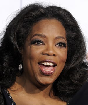 Oprah Winfrey arrives Nov. 1, 2009, at the premiere of the film "Precious" at AFI Fest 2009 in Los Angeles. "The Oprah Winfrey Show," an iconic broadcast that grew over two decades into a daytime television powerhouse and the foundation of a multibillion-dollar media empire, will end its run in 2011 after 25 seasons on the air, Winfrey's production company said Thursday night, Nov. 19, 2009.