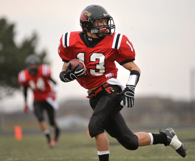 Metamora senior Dan Burk has proven a versatile and valuable asset to the Redbirds, who play host to Rochester in a Class 4A state semifinal 1 p.m. Saturday. The 5-foot-8 Burk has played six positions this season, including quarterback and fullback. “He’s the little engine that could,” says teammate Dave Kuhne.