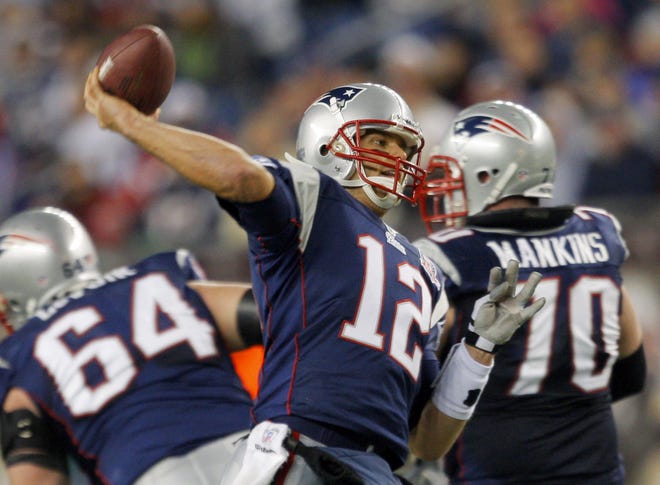 Patriots quarterback Tom Brady fires a pass during New England's 31-14 win over the Jets.