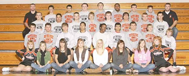 Members of the 2009-2010 Kewanee High School wrestling team are, second row from left, Brandon Rohrig, Doroteo Duarte, Mark Breedlove, Mariano Aguilar, Keon Andrews, Israel Luquin, Alphonso Inocencio, Corbin Uitermarkt and Steven Cleveland. Third row, Billy Garms, Tevin Jordan, Alan Grabbe, Trae Walters, Ian Fleming, Nick Swearingen, Jeff Nimrick and Cayon Tossell. Back row, head coach Charley Eads, Josh Moushon, Carlos Valencia, Jacob Grabbe, Cal Breedlove, Marselle Dunn, Austin Johnson, Brad Aman and assistant coach Ryan Senneff. Absent from the photo were Junior Castaneda and Tyler Conway. Seated in front are the team’s cheerleaders and statisticians.