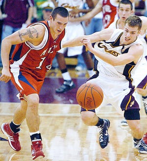 Malone’s Eric Coblentz (left) and Walsh’s Jeremy Shardo go after a loose ball during Tuesday’s Mayors’ Cup game at Alumni Arena. The Cavaliers defeated the Pioneers, 88-47.