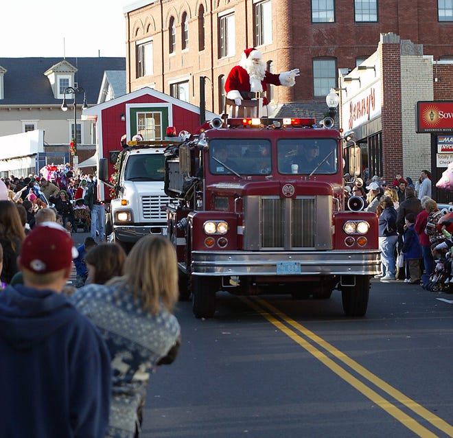 Santa Claus waves to children along Centre Street in Middleboro during the 2006 Christmas parade. Saturday’s parade steps off at 1 p.m. in downtown Middleboro.