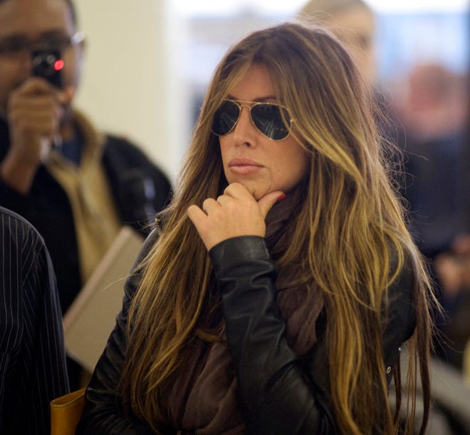 Rachel Uchitel arrives from New York at the Los Angeles International Airport on Sunday. The National Enquirer published a story alleging that golfer Tiger Woods, who was involved in a car accident near his home on Friday, had been seeing the New York night club hostess, and that they recently were together in Melbourne, where Woods competed in the Australian Masters. Uchitel denied having an affair with Woods when contacted by the Associated Press.