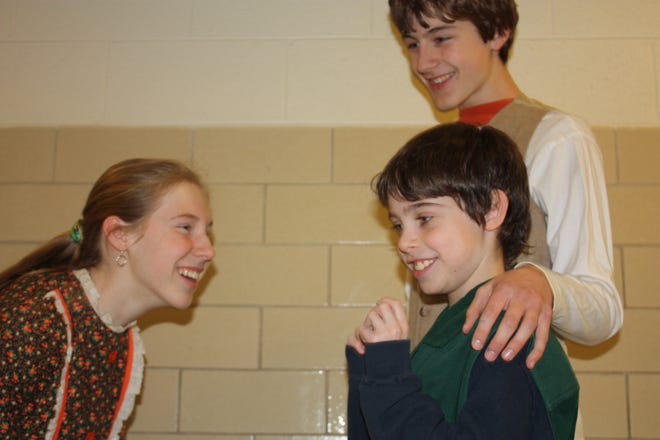 Catherine Cote, Kyran Schnur and Brent Liebowitz rehearse for the Hopkinton Middle School's production of "A Christmas Carol."