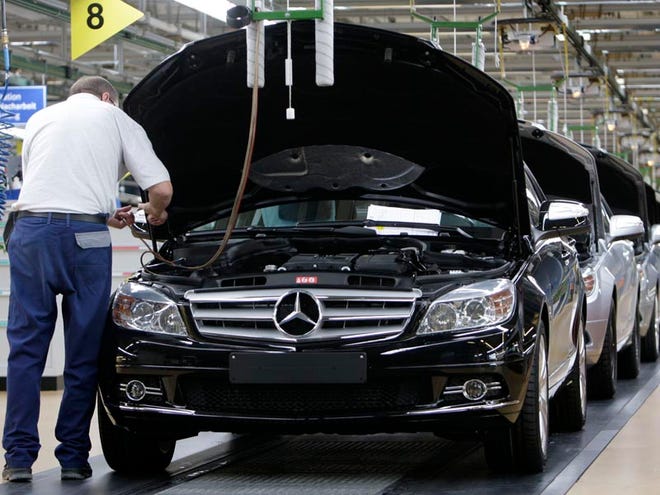 In this Jan. 25, 2008 file photo, an employee of German car producer Mercedes-Benz controls a Mercedes C-Class as it rolls off the production line in the plant in Sindelfingen, near Stuttgart, southern Germany. About 10,000 workers at Mercedes-Benz's Sindelfingen plant just outside Stuttgart, Germany, gathered Monday to ask management not to send production of its C-Class Mercedes cars to Tuscaloosa County, a move the company is considering to take advantage of lower production costs and to avoid currency fluctuations.