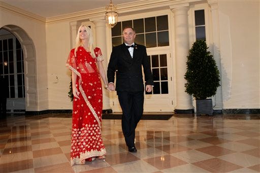 In this Tuesday, Nov. 24, 2009 photo, Michaele and Tareq Salahi, right, arrive at a state dinner hosted by President Barack Obama for Indian Prime Minister Manmohan Singh at the White House in Washington. The Secret Service is looking into its own security procedures after determining that the Virginia couple managed to slip into the state dinner at the White House even though they were not on the guest list, agency spokesman Ed Donovan said. Although the couple maintains they had an invitation e-mails between the couple and a Pentagon official show their invitation was not confirmed.