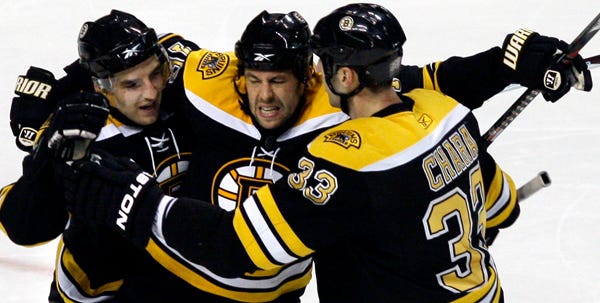 Bruins left wing Marco Sturm, center, celebrates his second-period goal with teammates Patrice Bergeron, left, and Zdeno Chara on Wednesday night.