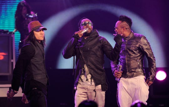 The Black Eyed Peas from left, Taboo, will. i. am and apl.de.ap perform at the Grammy Nominations Concert on Wednesday, Dec. 2, 2009, in Los Angeles. (AP Photo/Chris Pizzello)