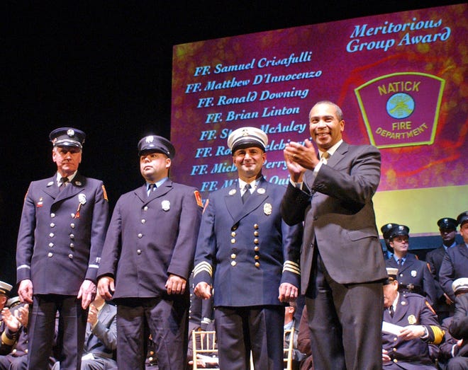 From left, Lt. Michael Aries, Firefighter Brian Linton and Deputy Chief Paul Tota represent Natick Fire Department yesterday as they receive a Meritorious Group Award from Gov. Deval Patrick during the 20th annual Firefighter of the Year Heroic Awards at the Hanover Theatre in Worcester.