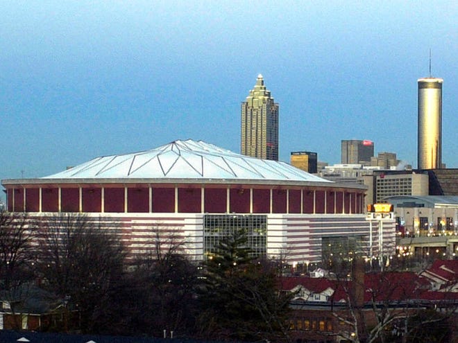 Night falls over the Georgia Dome and the city of Atlanta in this, Jan. 26, 2000 photo.