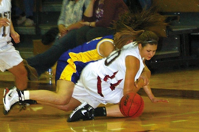 East's Elyssa LeBaron tries to get her arm free to grab a loose ball against Harpursville.