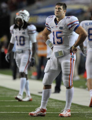 BOB SELF/The Times-UnionFlorida's Tim Tebow stands dejected on the sidelines after throwing an interception in the end zone Saturday in Atlanta.