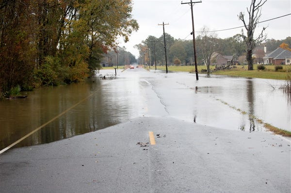Water floods both lanes of Bayou Narcisse Road between Roddy Road and Hwy. 431 in the St. Amant area Tuesday afternoon. Ascension Parish officials closed more than 30 roadways throughout the parish Tuesday due to the flooding.
