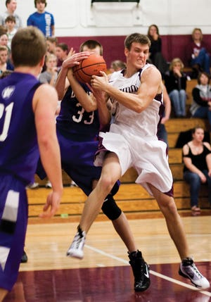 Skyler Edwards/Times staff
Tremont’s Steven Szetela (white jersey) and Delavan’s Brady Zimmer fight for the ball during Tuesday night’s non-conference game in Tremont.