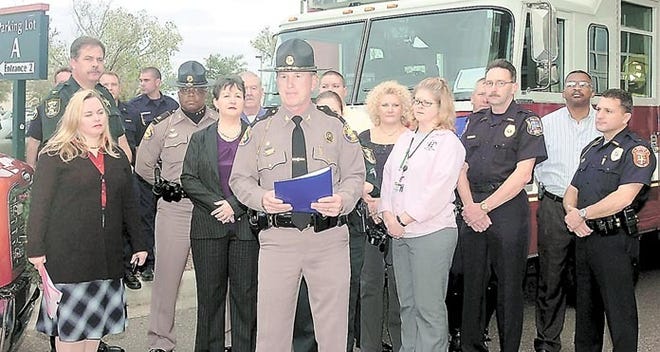 Standing in front of members of the St. Johns Community Traffic Safety and representatives of local law enforcement agencies, Florida Highway Patrol Lt. Bill Leeper talks at a press conference in front of Flagler Hospital, urging people to drive safely and not to drink and drive over the holiday season. By PETER WILLOTT, peter.willott@staugustine.com