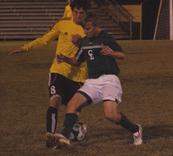 St. Amant’s Chase Squires battles for possession against Central Lafourche’s Marcel Delaune in the second half of the Gators’ 3-3 tie Wednesday night at the Pit.
