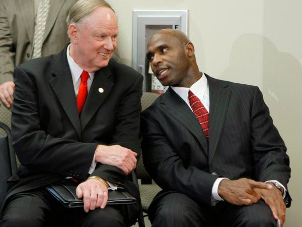 Former Florida defensive coordinator Charlie Strong, right, talks with University of Louisville President James Ramsey before being introduced as the new Louisville head football coach during an NCAA college football news conference in Louisville, Ky., Wednesday, Dec. 9, 2009.
