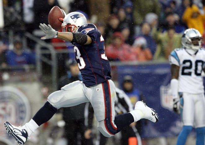 Patriots running back Kevin Faulk jumps into the end zone during New England's 20-10 win over the Panthers.