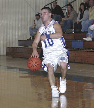 Burr Oak’s Ryan Bower halts his way up court Monday in the Bobcats’ 67-23 home-opening loss to Climax-Scotts.