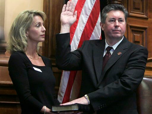 In this Monday, Jan. 8, 2007 file photo, Georgia House Speaker Glenn Richardson, R-Hirm, is sworn in as his wife Susan holds a Bible during the first day of the Georgia General Assembly in Atlanta. A top Democrat said Tuesday, Dec. 1, 2009 that an ethics complaint against House Speaker Glenn Richardson should be reopened after the Republican's ex-wife told Atlanta's Fox 5 that Richardson had an affair with a lobbyist.